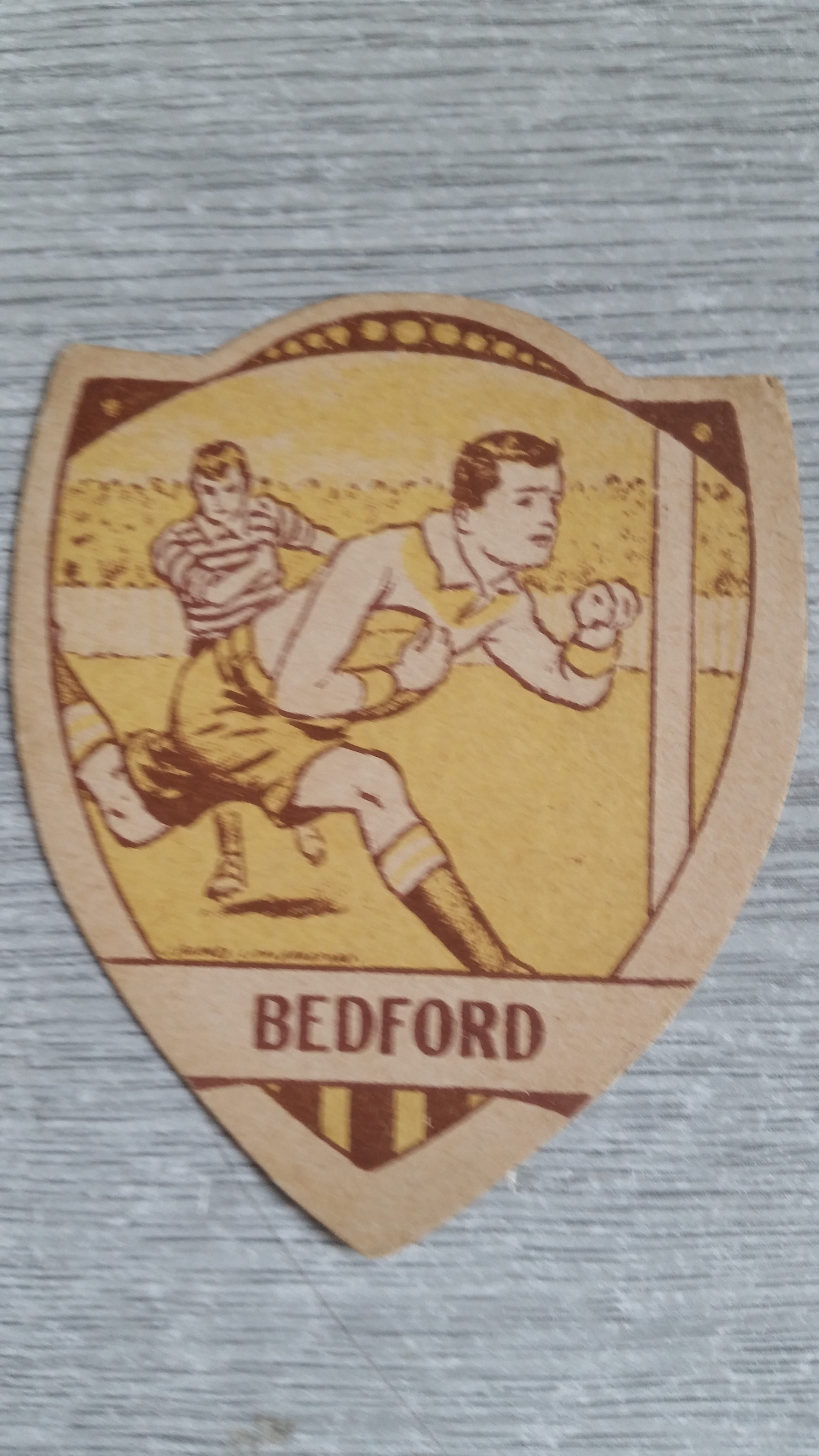 BAINES, shield-shaped rugby card, Bedford, action scene inset, VG