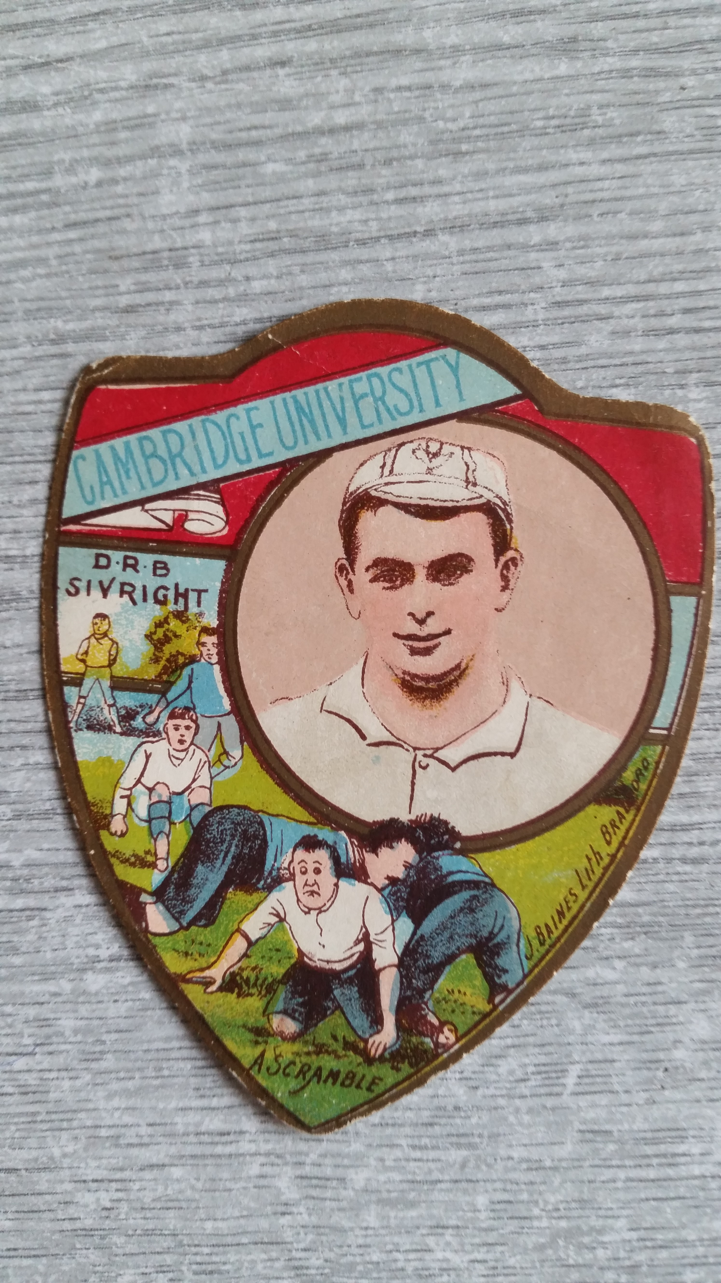 BAINES, shield-shaped rugby card, Cambridge University, D.R.B. Sivright inset, knocks to edges, G