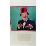 ENTERTAINMENT, signed album page (5 x 3.5) by Tommy Cooper, half-length in classic pose wearing fez,