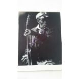 POP MUSIC, signed photo by Chuck Berry, half-length performing with guitar, 8 x 10, overmounted, VG