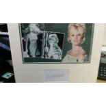 CINEMA, signed album page by Brigitte Bardot, slightly shaky signature, overmounted beneath three-