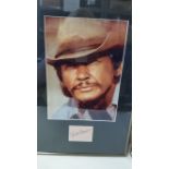 CINEMA, signed piece by Charles Bronson, overmounted beneath colour photo, h/s in cowboy hat, framed