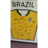 FOOTBALL, signed yellow replica Brazil shirt, 24 signatures attractively mounted, framed & glazed,
