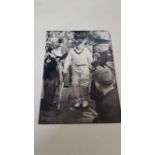 CRICKET, signed photo by Don Bradman, full-length walking out to bat, 7 x 5, EX