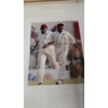 CRICKET, signed colour photo b Brian Lara, full-length celebrating running off pitch after victory