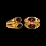 Roman Gold Double Bezel Ring with Garnets