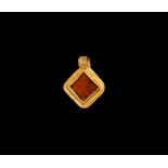 Migration Period Gold Pendant with Garnet