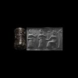 Akkadian Cylinder Seal with Deity and Worshippers