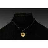 Roman Gold Pendant with Garnet and Beads