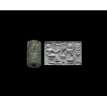 Post Akkadian Cylinder Seal with Robed Figures Beside Table