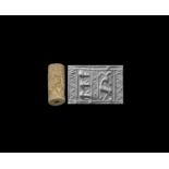 Faience Cylinder Seal with Human Heads