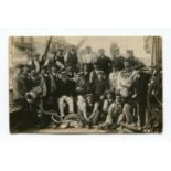 A photographic postcard of crew with diving equipment on a boat, published by Charles Harris, Dover,