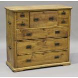 A late 19th/early 20th century camphor campaign secrétaire chest of five short and three long