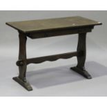 A late 20th century Arts and Crafts style oak side table, fitted with a single frieze drawer, on