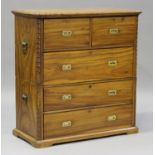 A 20th century camphor campaign chest of two short and three long drawers with brass recessed