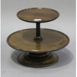 A late Victorian mahogany graduated two-tier lazy Susan, raised on a turned circular base, height