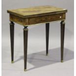 A late 19th century French kingwood and marquetry inlaid writing/games table, the fold-over top