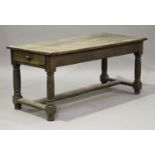 An 18th century French provincial oak kitchen table, the rectangular top above two end drawers,