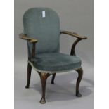 An early 20th century Queen Anne style elbow chair, the seat and back upholstered in blue velour,