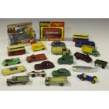 A collection of Dinky Toys cars, commercial vehicles and public transport vehicles, including a