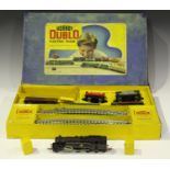 A collection of Hornby Dublo three-rail and two-rail items, including an EDG19 tank goods set, an