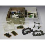 A collection of Britains plastic Floral Miniature Garden items, including two greenhouses, four rock