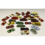 A collection of Dinky Toys cars, including a No. 157 Jaguar, finished in red with spun hubs, a No.