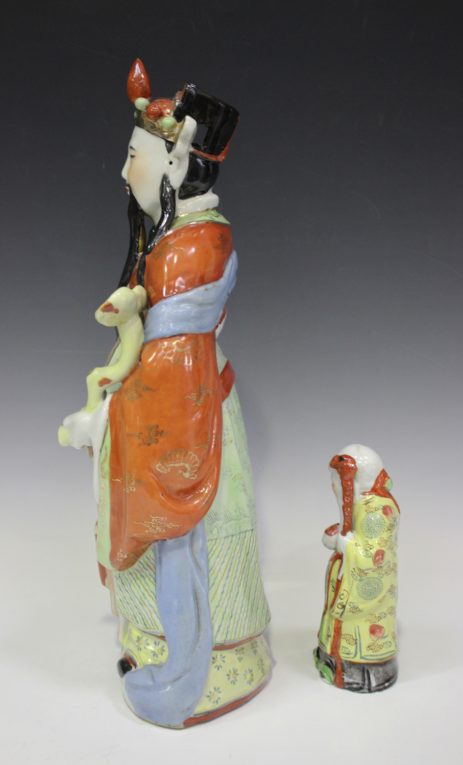 A Chinese porcelain figure of an immortal, mid-20th century, modelled standing wearing a long robe - Image 4 of 6