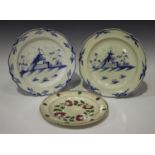 A pair of blue painted pearlware plates, early 19th century, each with a chinoiserie scene, diameter