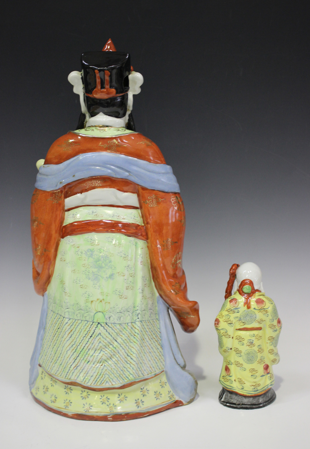 A Chinese porcelain figure of an immortal, mid-20th century, modelled standing wearing a long robe - Image 5 of 6