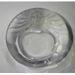 A Lalique glass ashtray, post-1945, of circular shape, moulded with a frosted lion's head to the