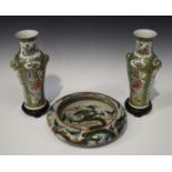 A pair of Chinese Canton famille rose porcelain vases, late 19th century, each slender baluster body