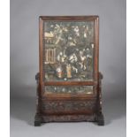 A Chinese hardwood and inlaid hardstone screen and stand, late Qing dynasty, the rectangular panel