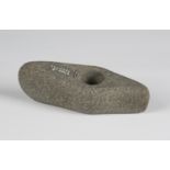 A Danish Neolithic pecked stone axe head of perforated boat form, bearing Hugh Fawcett monogram