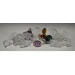 A collection of glass paperweights, 20th century, comprising a Wedgwood brown tinted squirrel, a