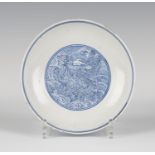 A Chinese blue and white porcelain 'dragon' saucer dish, mark of Qianlong and possibly of the