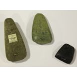 A group of three French Neolithic polished stone axe heads, one bearing 'F.S. Clark Collection'