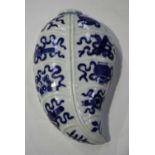 A Chinese blue and white porcelain leaf shaped wall vase, 18th century style but later, the ten