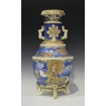 A Japanese Satsuma earthenware vase, Meiji period, painted and gilt with figures and dragon on a