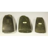 A group of three New Zealand polished stone axe heads, one bearing F.S. Clark monogram, length 10cm,