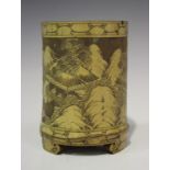 A Chinese bamboo brushpot, late Qing dynasty, carved in low relief with a continuous scene of