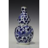 A Chinese blue and white porcelain bottle vase, mark of Kangxi but later 19th century, painted