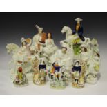 A large mixed group of Staffordshire figures, late 19th century, including an equestrian Tom King,