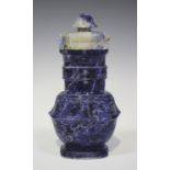 A Chinese archaistic lapis lazuli vase and cover, 20th century, the body carved in low relief with