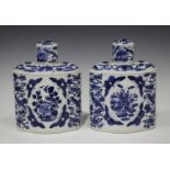 A pair of Chinese blue and white export porcelain tea caddies and covers, mid-19th century, each