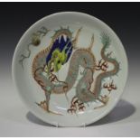 A Chinese famille verte porcelain circular dish, probably late Qing dynasty, painted with a dragon