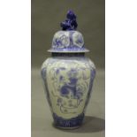 A Japanese Arita blue and white porcelain jar and domed cover with Buddhistic lion finial, Meiji