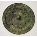 A Chinese archaic bronze circular mirror, possibly Tang dynasty, one side cast with a tiger, a