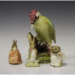 A Beswick woodpecker, No. 1218, height 21cm, together with three Beswick Beatrix Potter figures,