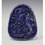 A Chinese lapis lazuli pendant, modern, carved in relief with a dragon and phoenix, length 9.2cm.